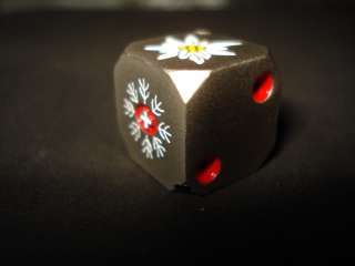 this a very heavy White metal Steel /or Titanium???/ engraved Dice 