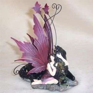  Fairy Sitting Against Black Unicorn Figurine: Home 
