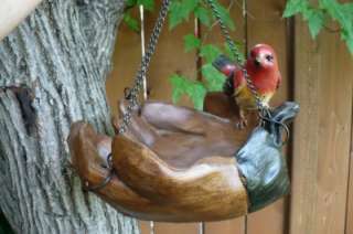 NEW BIRD SITTING ON 2 GLOVES SHAPED AS HAND BIRD FEEDER  