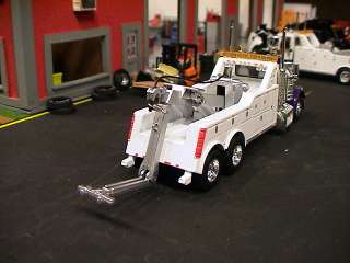   CUSTOM BUILT TRUCK WITH A WRECKER BODY FOR THOSE HEAVY DUTY TOWS