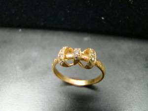 ADORABLE 14k diamond studded antique style bow ring  